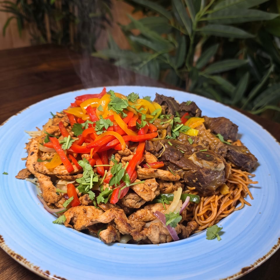 A blue plate of stir-fried noodles, chicken, beef, colorful peppers, mushrooms, onions, and cilantro on a wooden table.